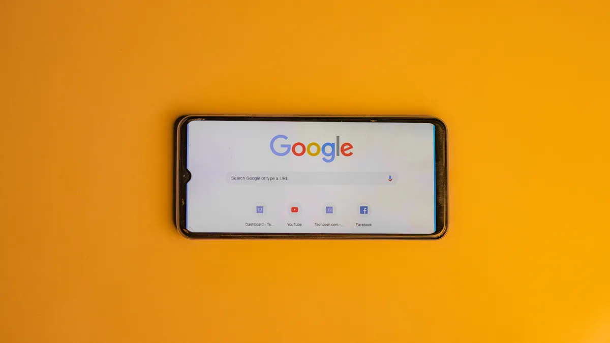 Ahrefs Rank Tracker vs Semrush Position Tracking vs SE Ranking — Smart Phone with a Google Search Page on its Display